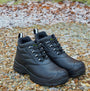 Apache HAMILTON Unisex Boots Black front view showcasing safety features and lace-up design on rocky ground.
