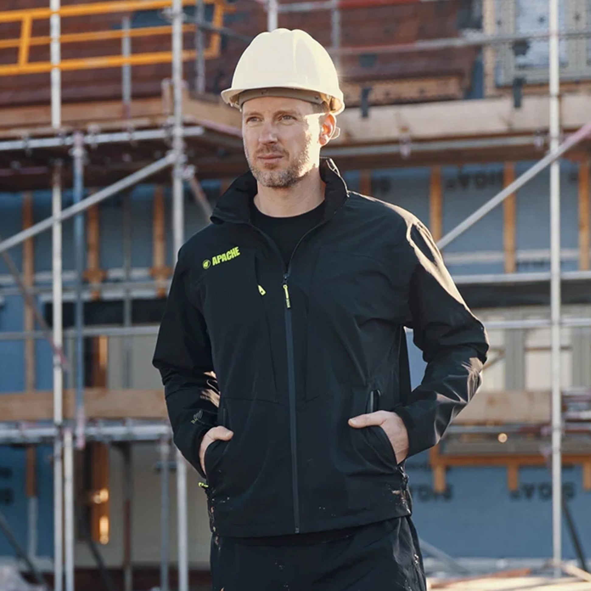Apache OTTAWA Mens Waterproof Coat Black front view, worn by a man on a construction site.