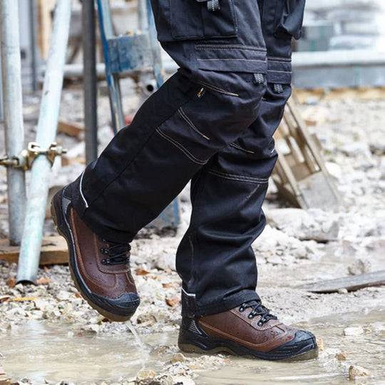 Apache RANGER Unisex Boots Brown side view worn in puddle, showcasing comfort and water resistance features.