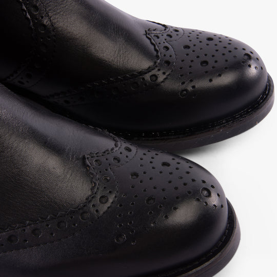Band Wagon ELGIN Mens Chelsea Boots Black detail view highlighting leather texture and decorative perforations.