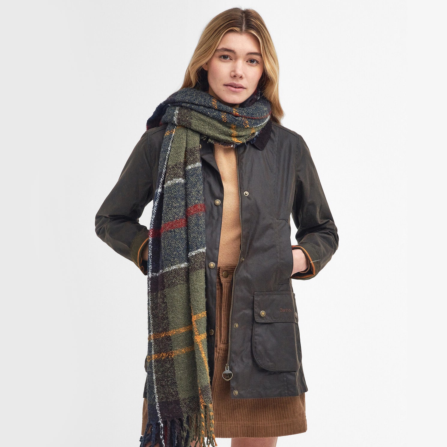 Barbour TARTAN BOUCLE Scarf Womens Classic worn by model, front view, showcasing textured design and tasselled hem.
