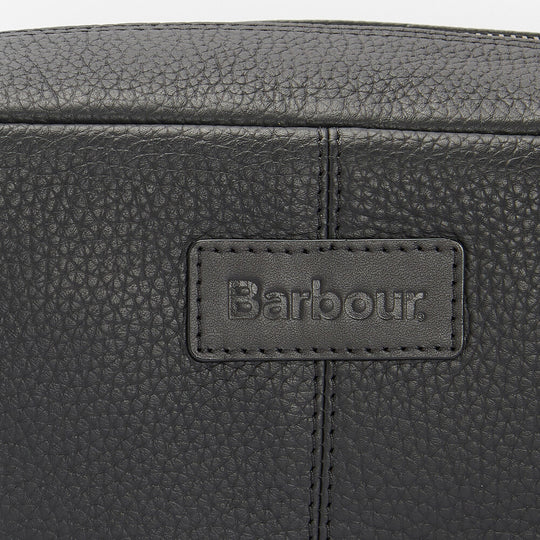 Barbour HIGHGATE LEATHER Mens Wash Bag Black detail view of leather texture and logo