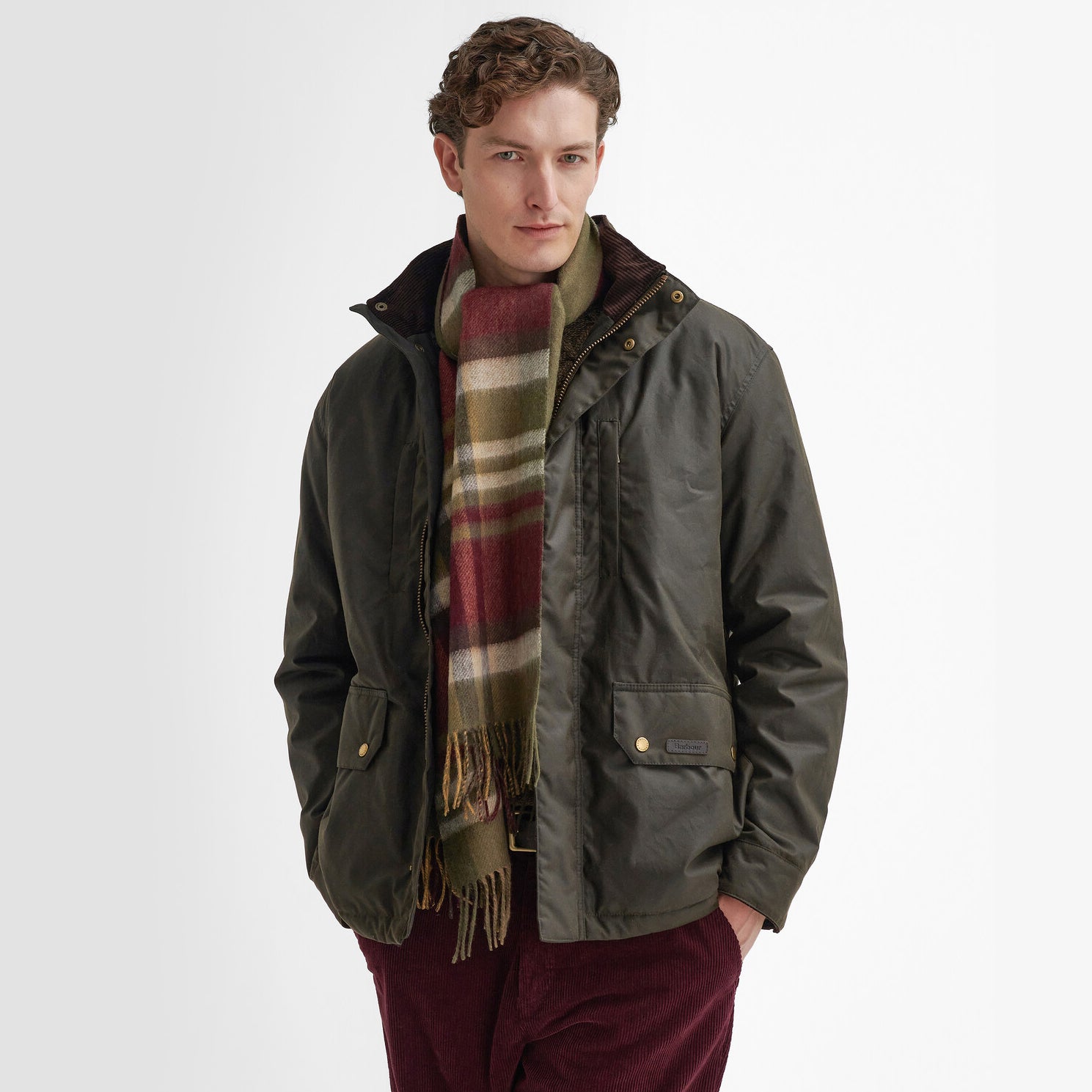 Barbour FIELD REVERSIBLE Scarf Unisex Adults Army Green styled with a jacket, showcasing its comfort and wool material.