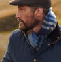 Barbour FIELD REVERSIBLE Scarf Unisex Adults Navy side view on model, showcasing premium lambswool and check design.