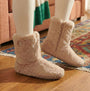 Bedroom Athletics MARILYN Womens Faux Fur Boot Slippers Gingerbread side view on model wearing on wooden floor