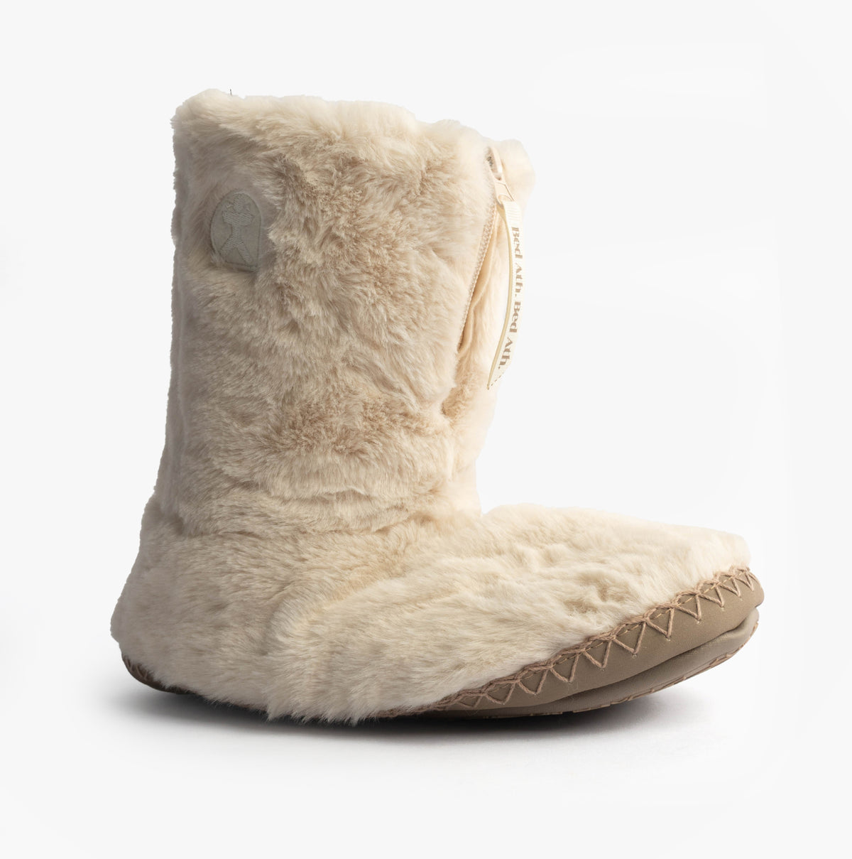 Bedroom Athletics MONROE Womens Faux Fur Boot Slippers Cream/Moonrock side view showcasing soft faux fur upper.