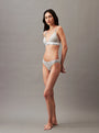 Calvin Klein MODERN LOGO Womens Bikini Briefs Grey Heather side view on model showcasing fit and design with CK signature waistband.