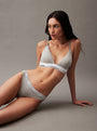 Calvin Klein MODERN LOGO Womens Bikini Briefs Grey Heather side view on model, showcasing medium-rise waist and CK signature elastic waistband.