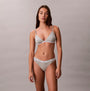 Calvin Klein Icon Logo Womens 3 Pack Thong Multi front view of model wearing gray thong and bralette set