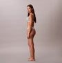 Calvin Klein Icon Logo Womens 3 Pack Thong Multi side view of model wearing thong underwear in light color.