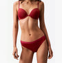 Calvin Klein MODERN LOGO HOLIDAY Womens 3 Pack Bikinis Multicoloured front view showcasing a model in red bikini and matching bottom.