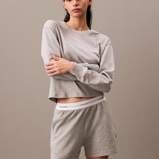 Calvin Klein MODERN TERRY Womens Sweatshirt Grey Heather front view on model, showcasing comfort and style.
