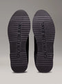 Calvin Klein RETRO RUNNER ICONIC Mens Trainers Black/Bright White bottom view showing rubber sole with CALVIN KLEIN JEANS branding.