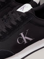 Calvin Klein RETRO RUNNER ICONIC Mens Trainers Black/Bright White detail view showcasing logo and laces.