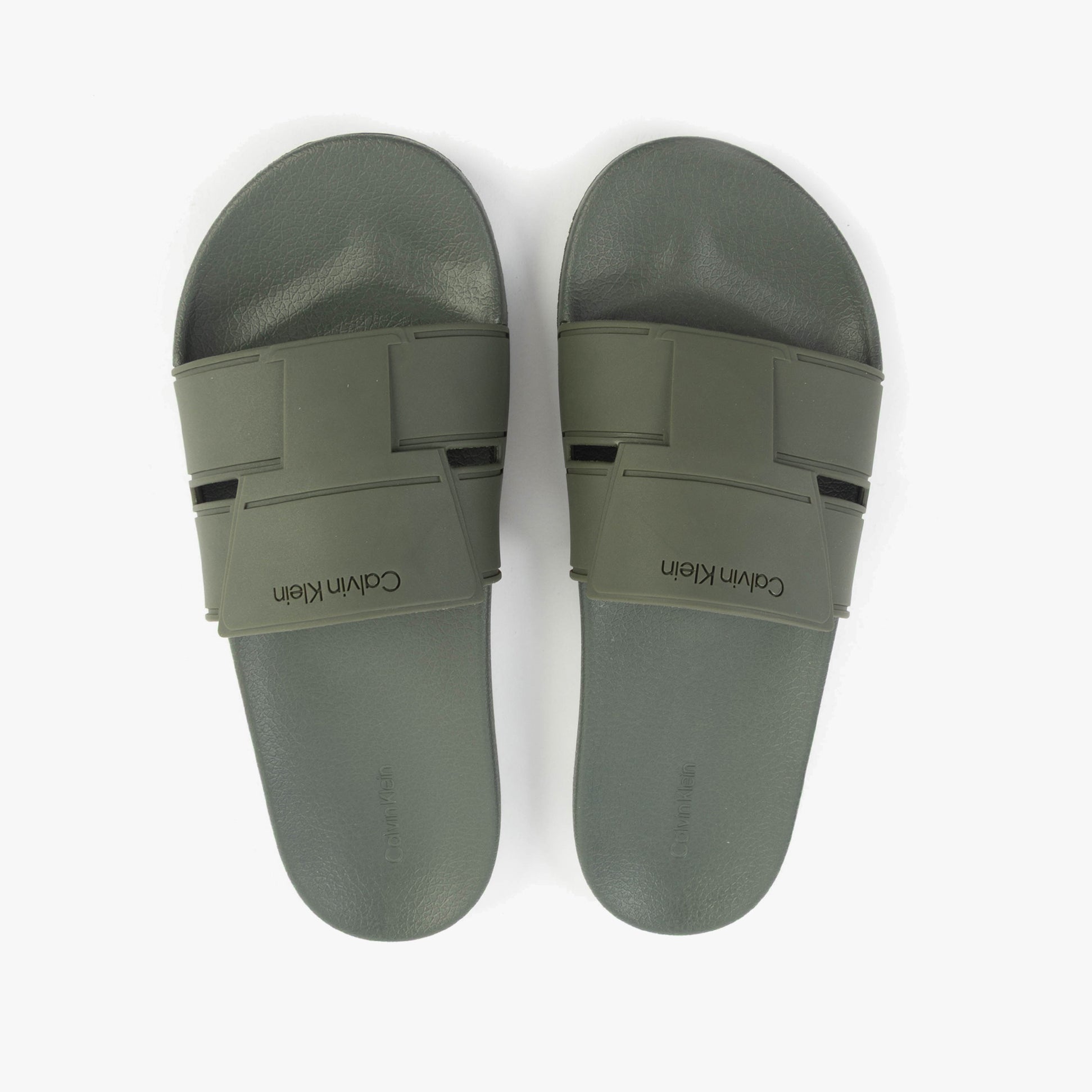 Calvin Klein POOL SLIDE DOUBLE T Mens Sliders Dark Olive top view showcasing lightweight synthetic design and slip-on closure.
