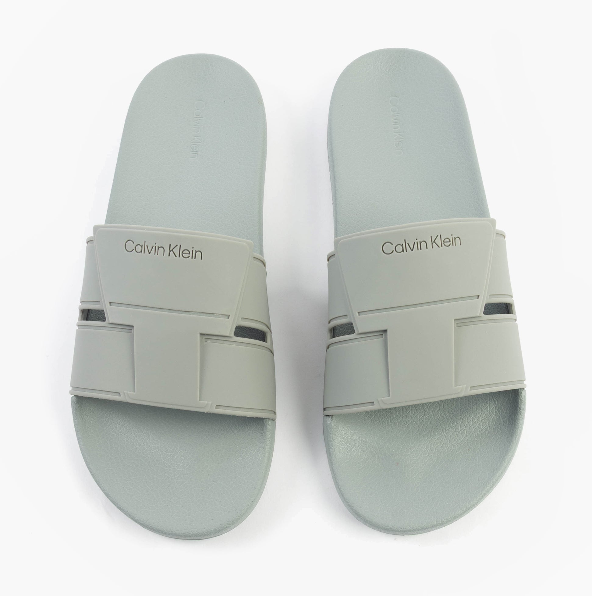 Calvin Klein POOL SLIDE DOUBLE T Mens Sliders Granite Road top view, showcasing slip-on design and synthetic materials.