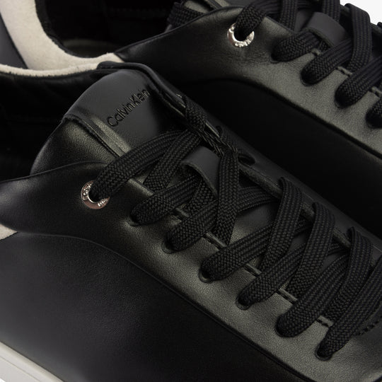 Calvin Klein CUPSOLE LACE UP Womens Trainers Black/White detail view highlighting the leather upper and lace-up closure.