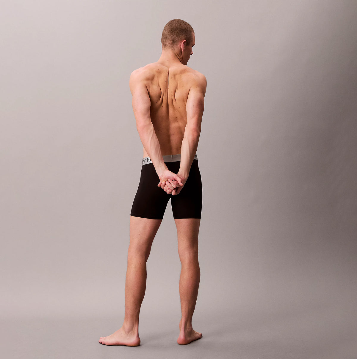 Calvin Klein LV00NB4124 BOXER BRIEF 3 PACK Mens Low Rise Trunks Multicoloured, back view on model, showcasing fit and style.