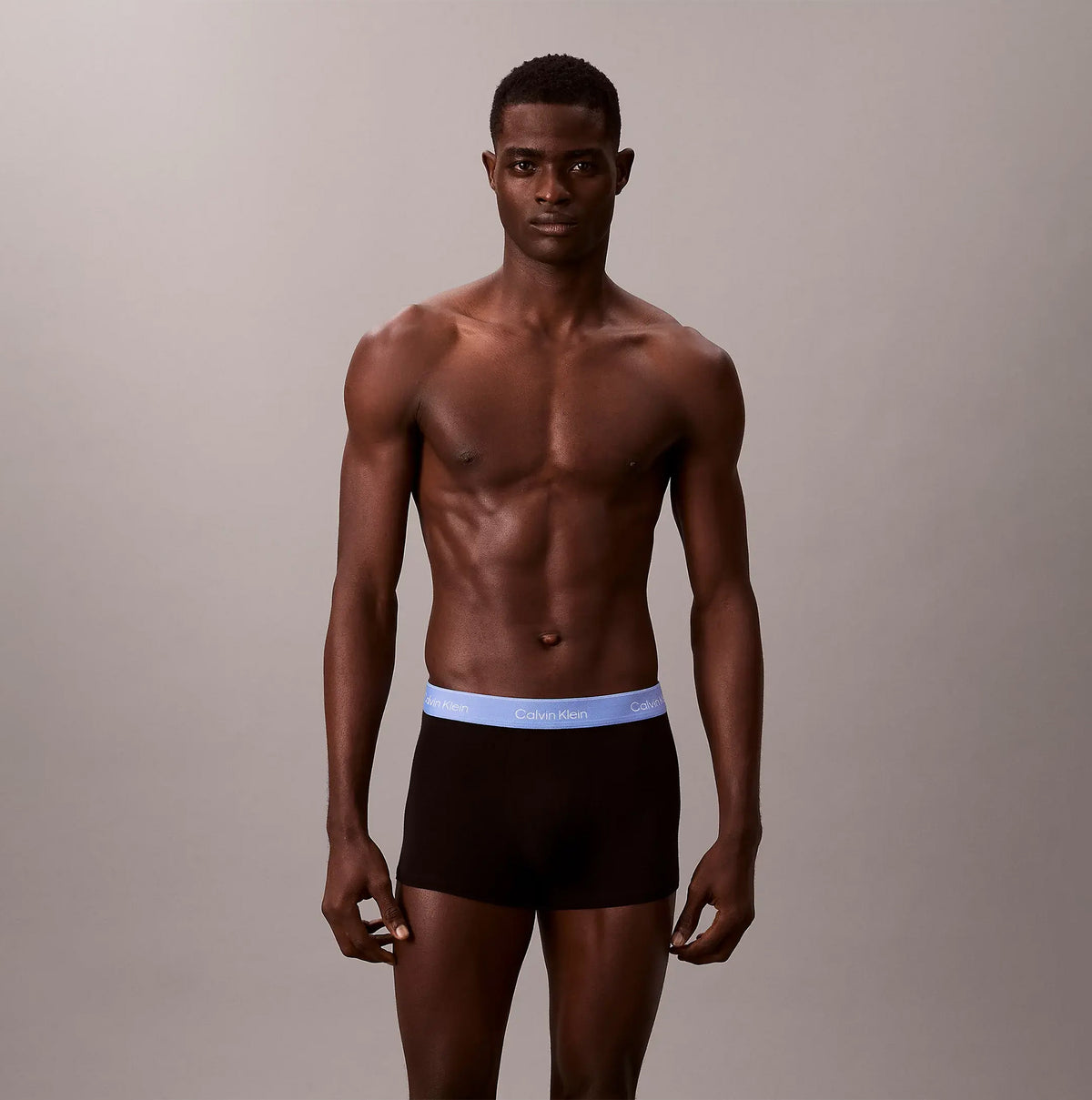 Calvin Klein TRUNK 5 Pack Mens Multicoloured front view of model wearing black trunk underwear with blue waistband
