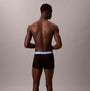Calvin Klein TRUNK 5 Pack Mens Multicoloured - Back view of model wearing black trunk underwear with blue waistband.