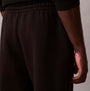 Calvin Klein QUILTED JOGGER Mens Joggers Black side view, showcasing the textured fabric and elastic waistband.