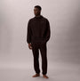 Calvin Klein QUILTED HOODIE Mens Hoodies Black on model, side view, showcasing long sleeves and relaxed fit.