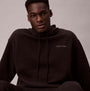 Calvin Klein QUILTED HOODIE Mens Hoodies Black front view of model wearing hoodie with logo detail