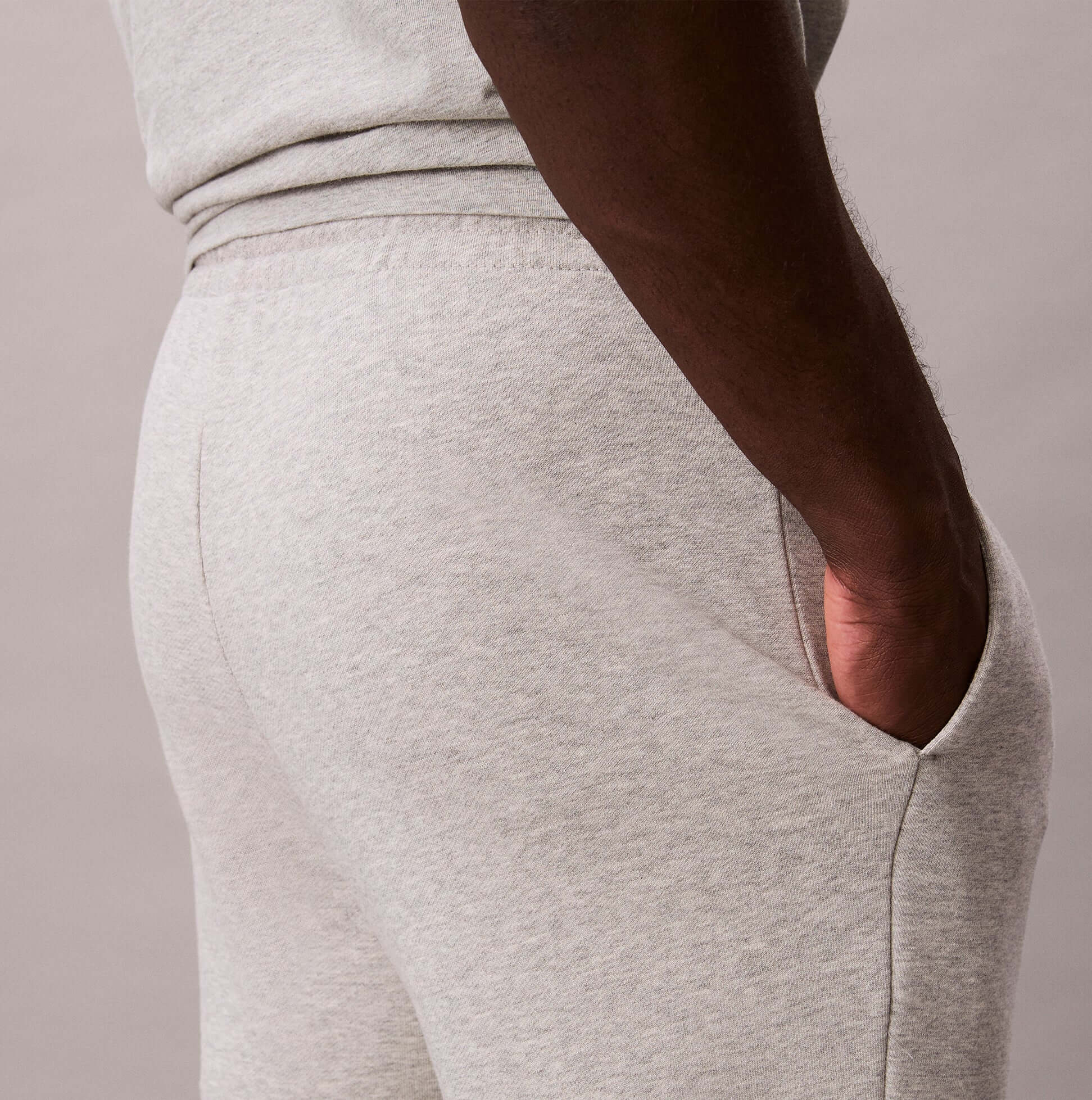 Calvin Klein JOGGER Mens Grey Heather side view showing pocket detail and grey heather fabric texture.