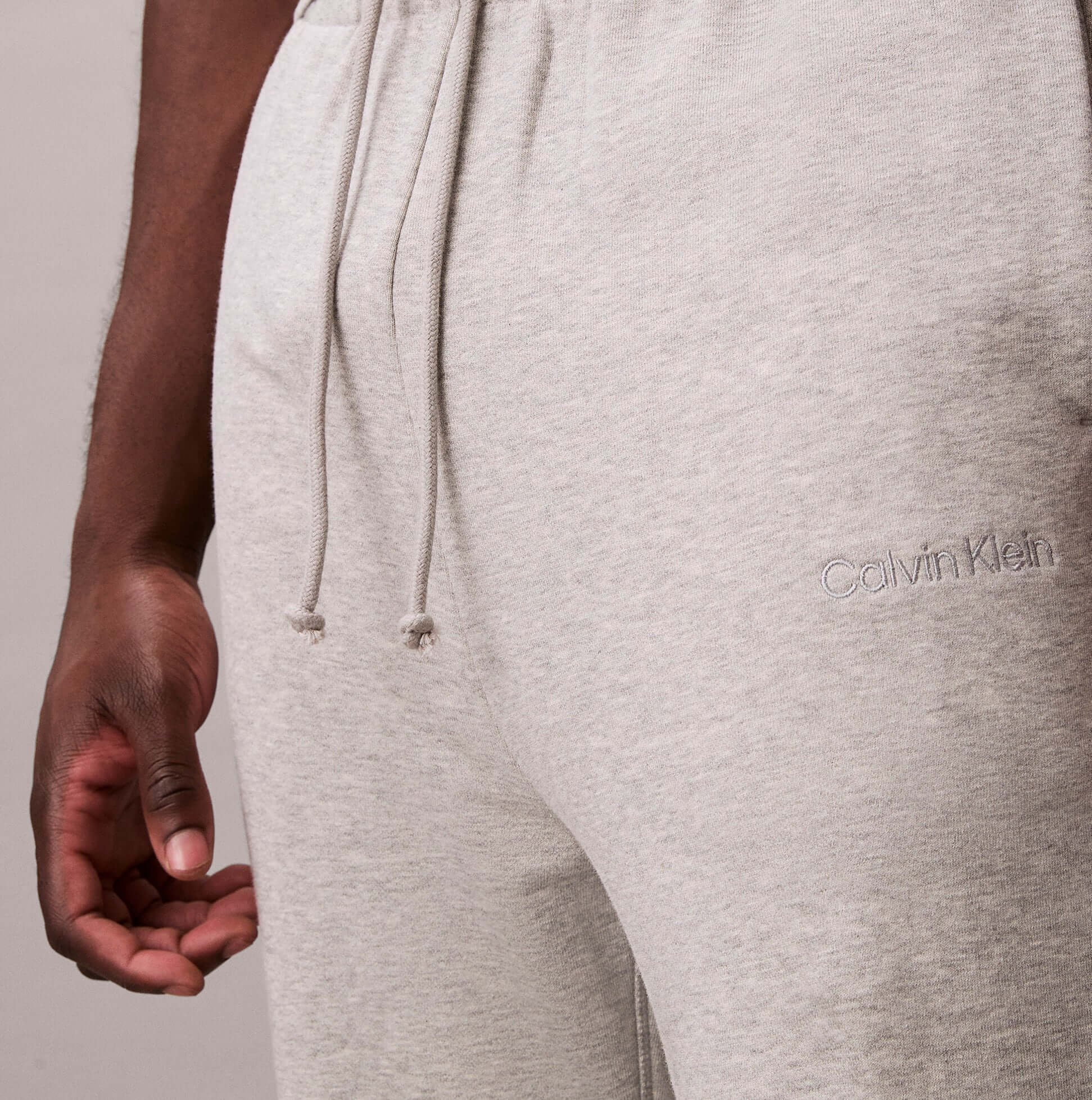 Calvin Klein JOGGER Mens Grey Heather detail view showcasing soft fabric and logo embroidery.