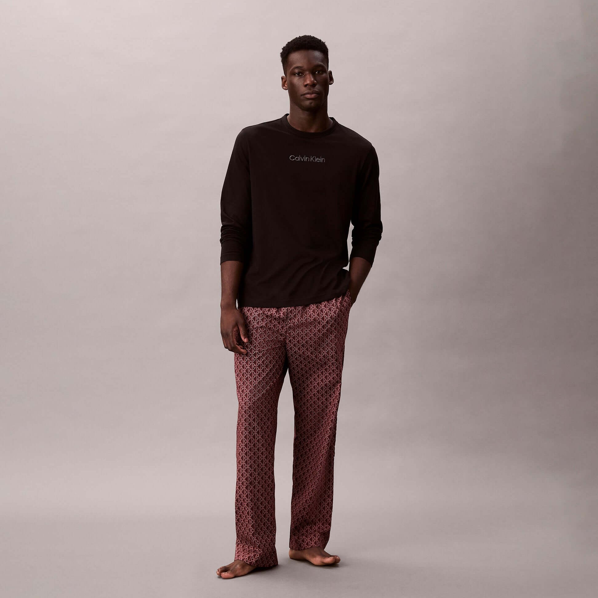 Calvin Klein LS TEE PANT SET Mens Multicoloured front view featuring a model in long sleeve tee and patterned pants.