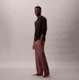 Calvin Klein LS TEE PANT SET Mens Multicoloured side view model wearing black long-sleeve tee and patterned pants.
