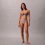 Calvin Klein BIKINI 3 PACK Womens Bikini Multicoloured front view of model wearing beige bikini and bra.