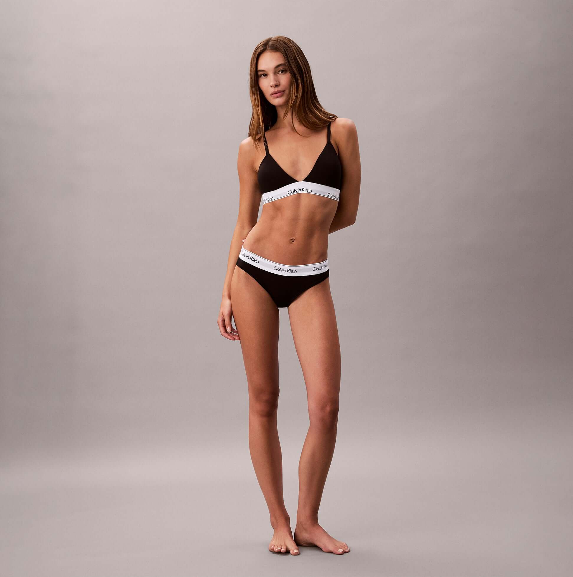 Calvin Klein Icon Cotton Modal Womens Bikini Briefs Black front view on model wearing matching bikini top.
