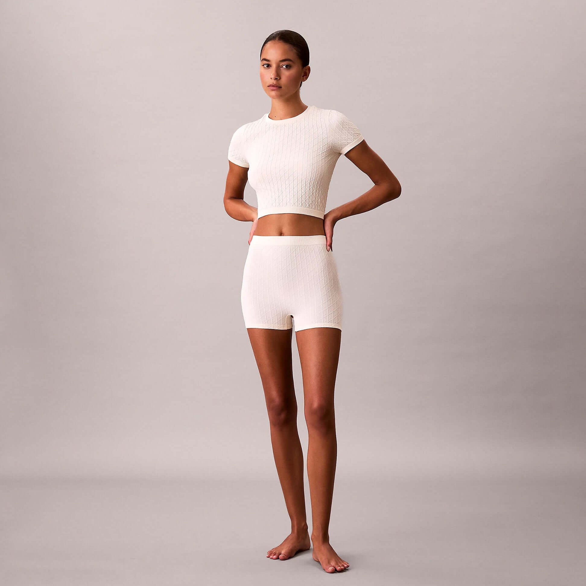 Calvin Klein SEAMLESS SHORTIE Womens Shorts Ivory front view model wearing matching top and shorts.