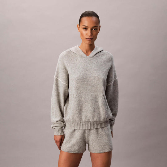 Calvin Klein PLUSH HOODIE. Womens Hoodies Grey Heather front view showcasing a stylish and cozy design.