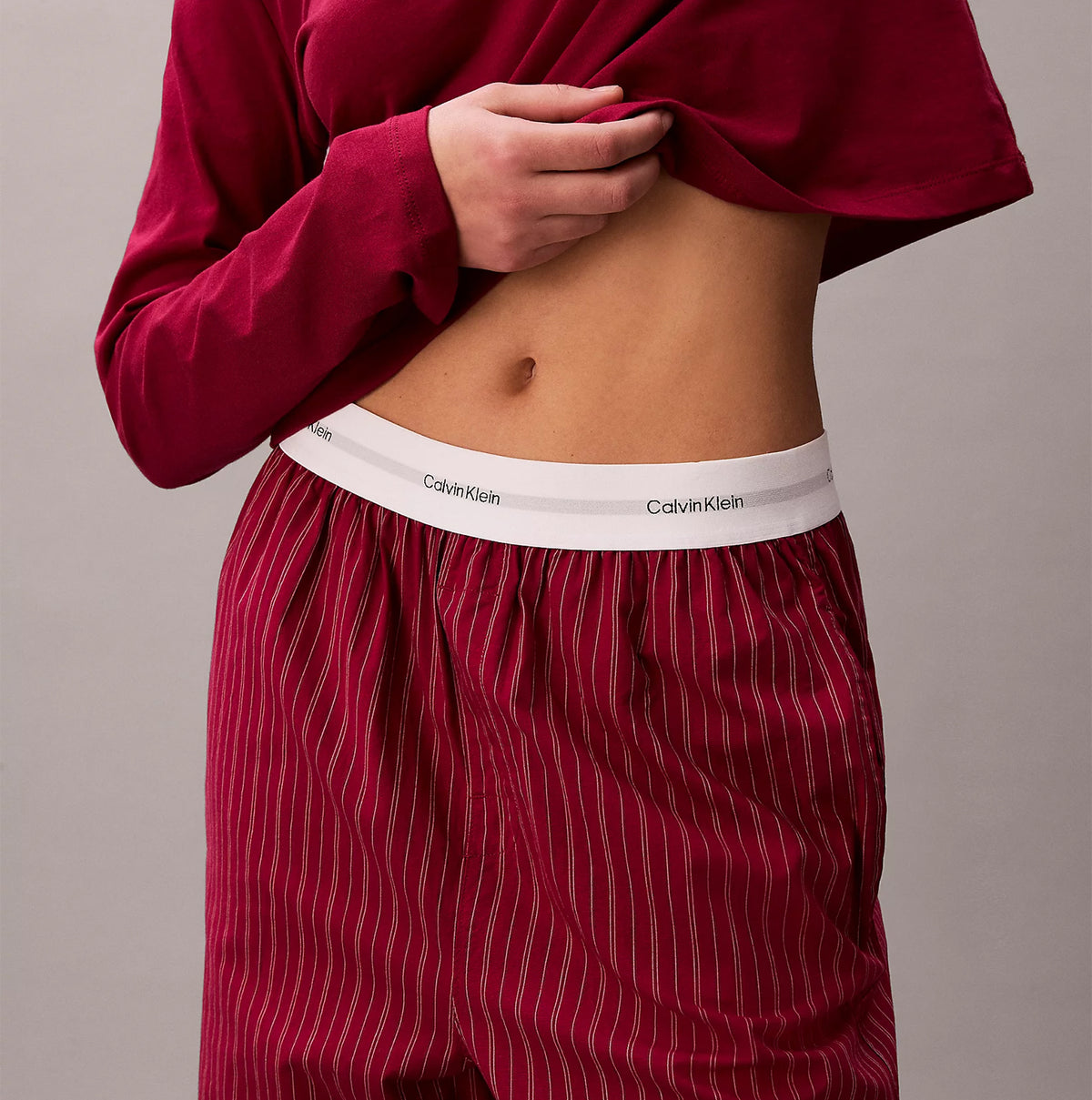 Calvin Klein LS TEE FLANNEL PANT Womens Pant Set Red detail view showcasing waistband and fabric texture.