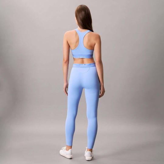 Calvin Klein Womens Quick-Dry Medium Impact Sports Bra Blue back view with matching blue leggings.