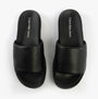 Calvin Klein FLAT MOLDED SLIDE Mens Triple Black top view showcasing leather upper and slip-on design.
