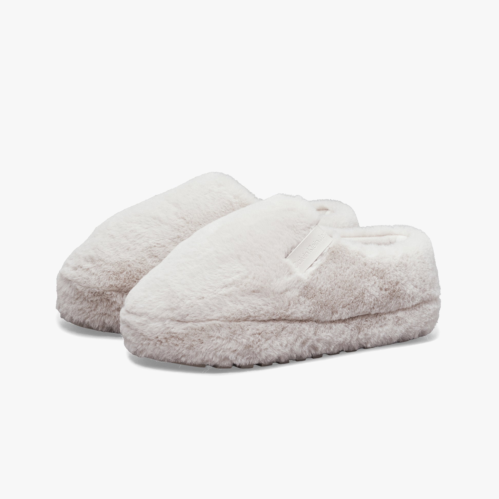 Calvin Klein HOME ANKLE Womens Slippers Triple Eggshell side view showing soft faux fur material and slip-on design.