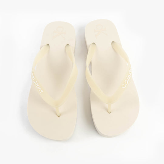 Calvin Klein BEACH SANDAL FLATFORM Womens Sandals Eggshell/Bright White top view showcasing the slip-on design.