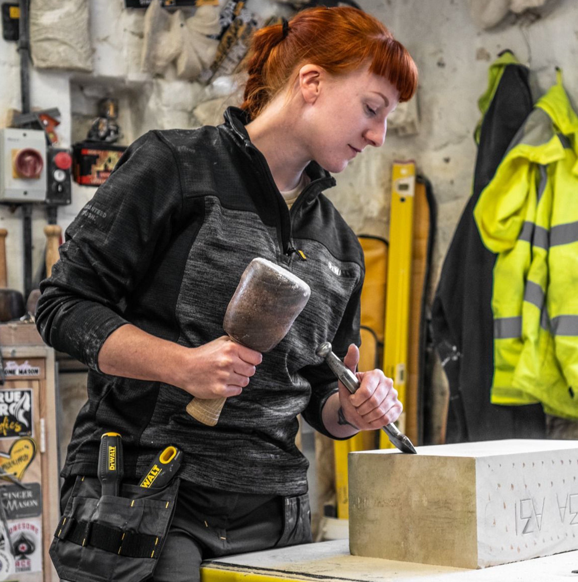 Dewalt CHARLOTTE Womens Sweatshirt Grey Black front view of woman using chisel and mallet in workshop
