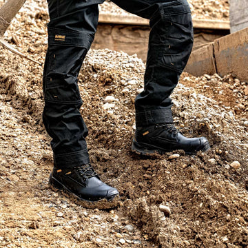 Dewalt SPRINGFIELD Mens Boots Black close-up on feet in construction environment, showcasing safety features and durable design.