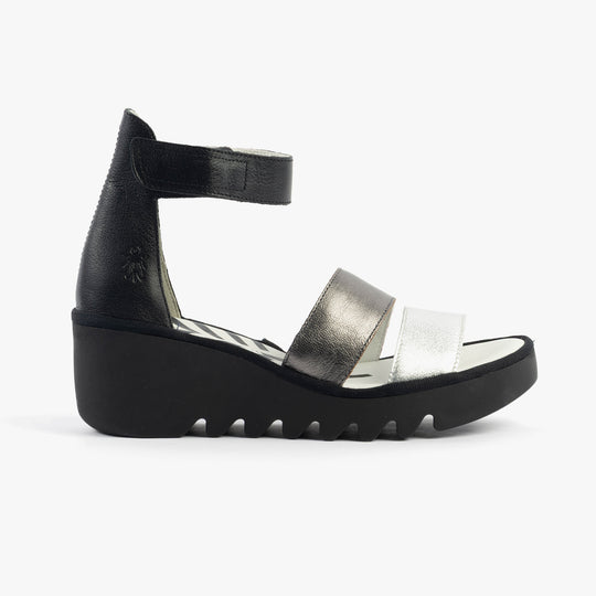 Fly London BONO290FLY Womens Sandals Silver/Graphite/Black side view showing wedge heel and leather upper material.