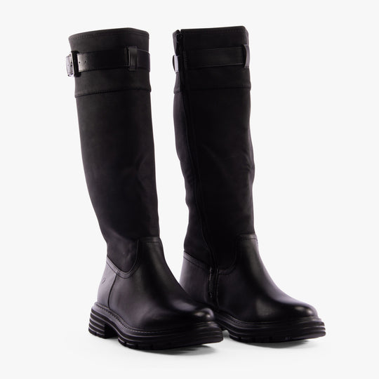 Heavenly Feet BRIANNA Womens Tall Boots Black side view showing knee high faux leather design and rubber sole.