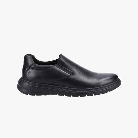 Hush Puppies TRENT Mens Shoes Black side view, comfortable leather slip-on shoes with flexible outsole.