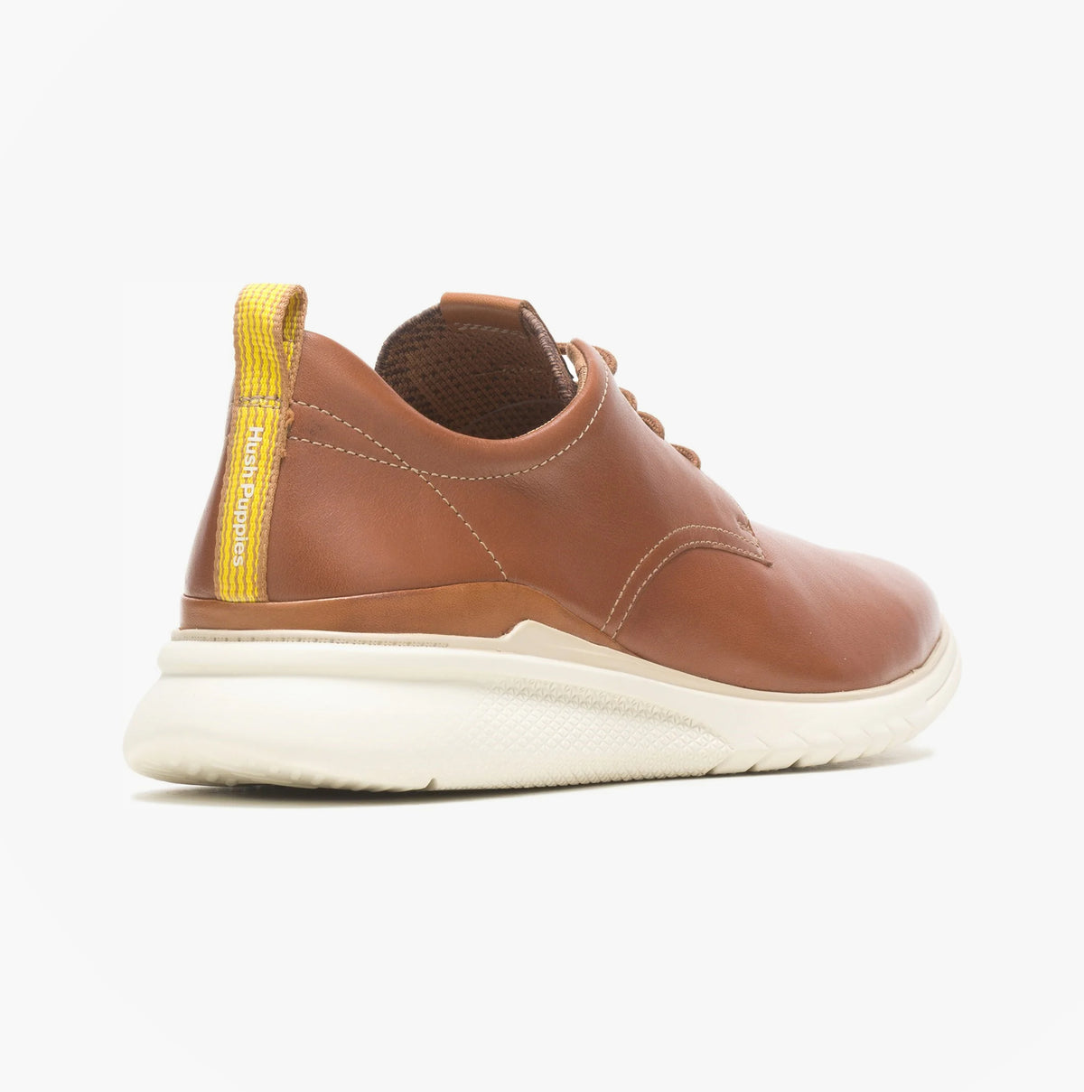 Brown leather shoe with yellow accents on a white background