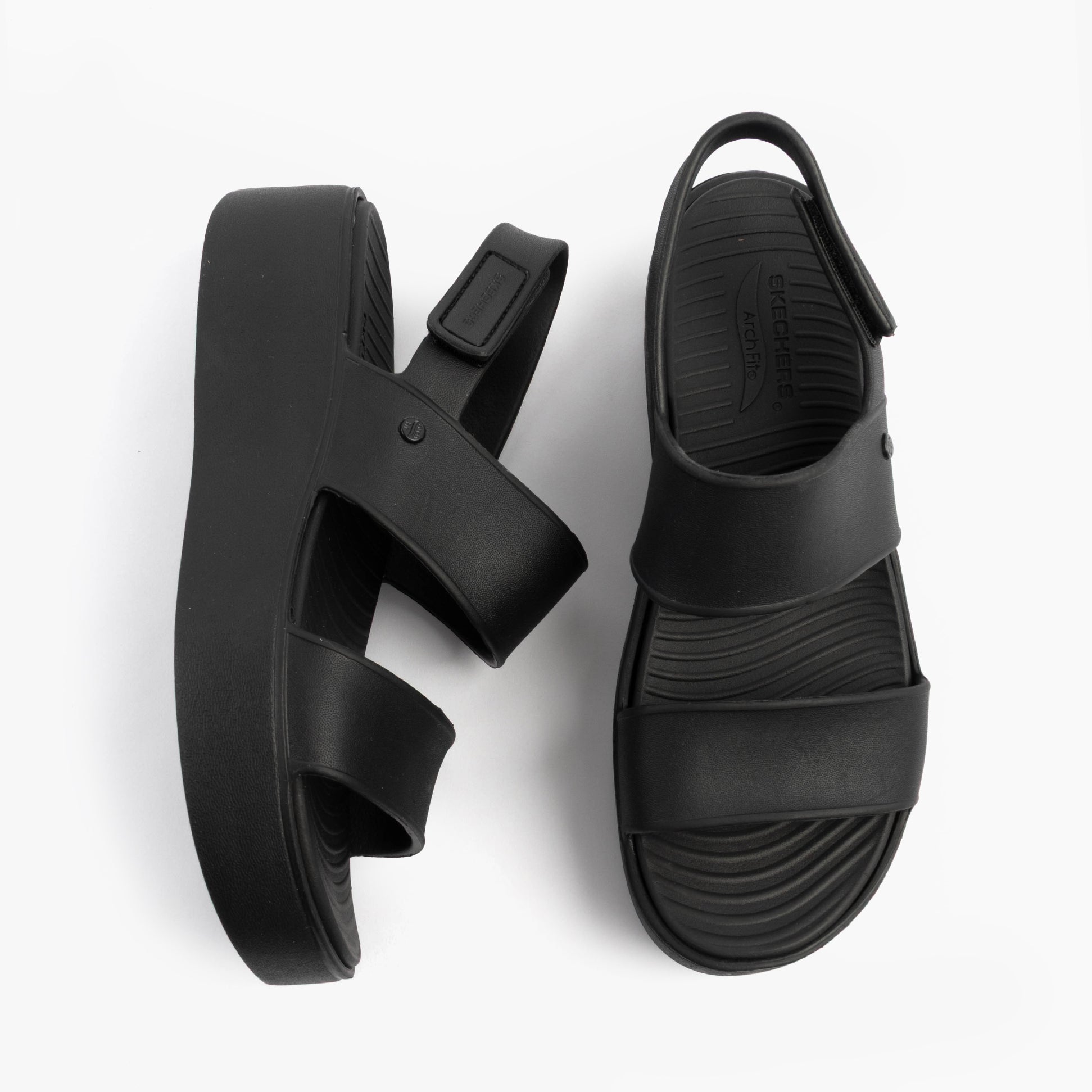 Skechers 111257/BBK ARCH FIT UPBEAT - SUNRISE Womens Sandals Black top view showcasing thick straps and platform sole.