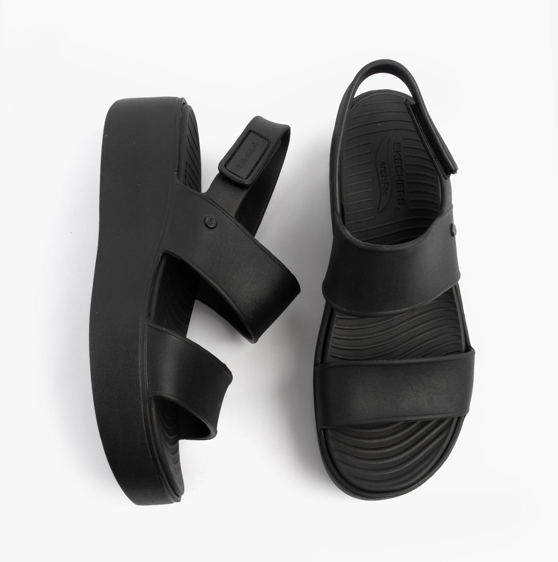 Skechers 111257/BBK ARCH FIT UPBEAT - SUNRISE Womens Sandals Black top view showcasing thick straps and platform sole.