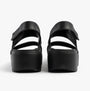 Skechers 111257/BBK ARCH FIT UPBEAT - SUNRISE Womens Sandals Black back view, featuring comfortable platform style.