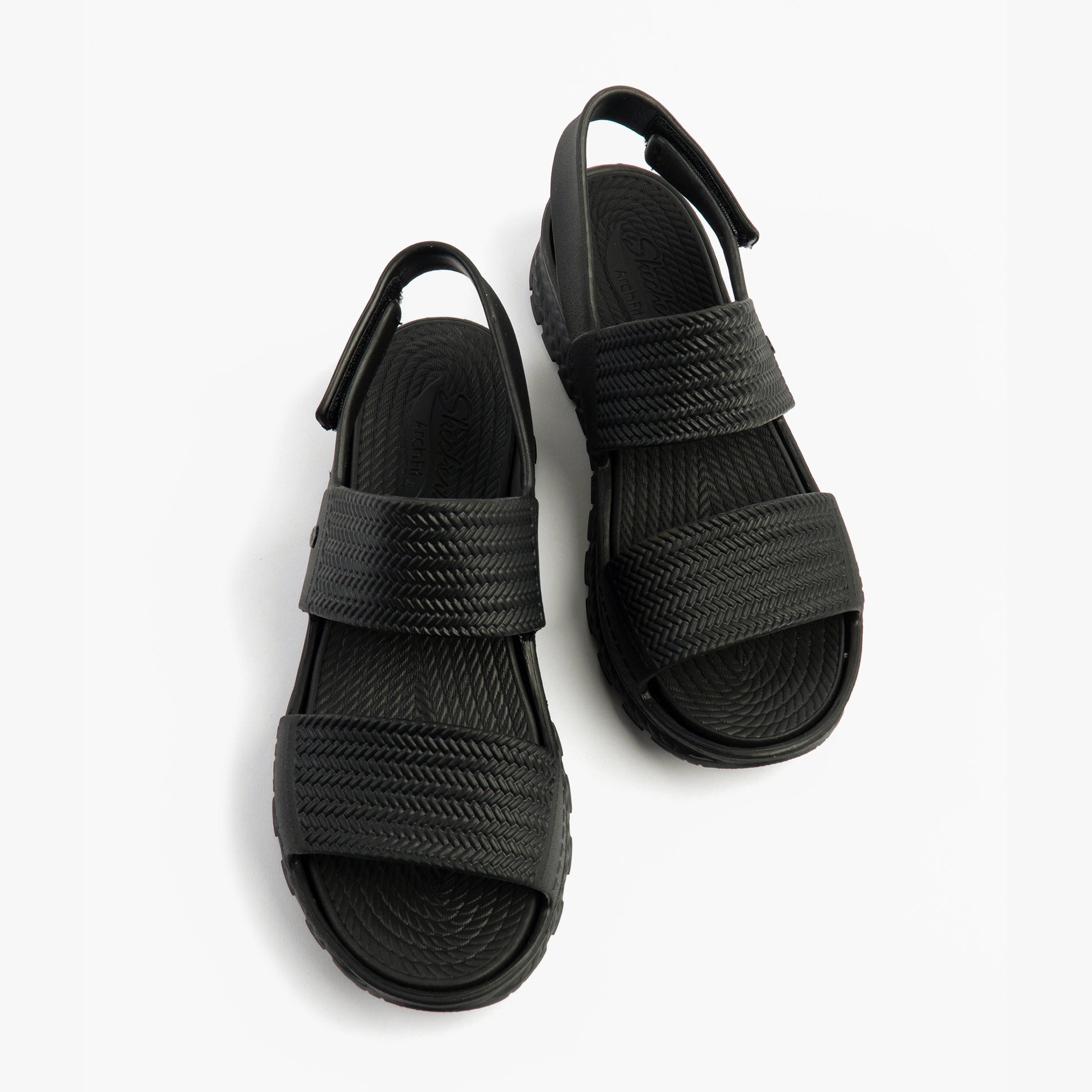 Skechers 111461/BBK ARCH FIT FOOTSTEPS - SUNNY DAYS Womens Sandals Black top view with adjustable straps.